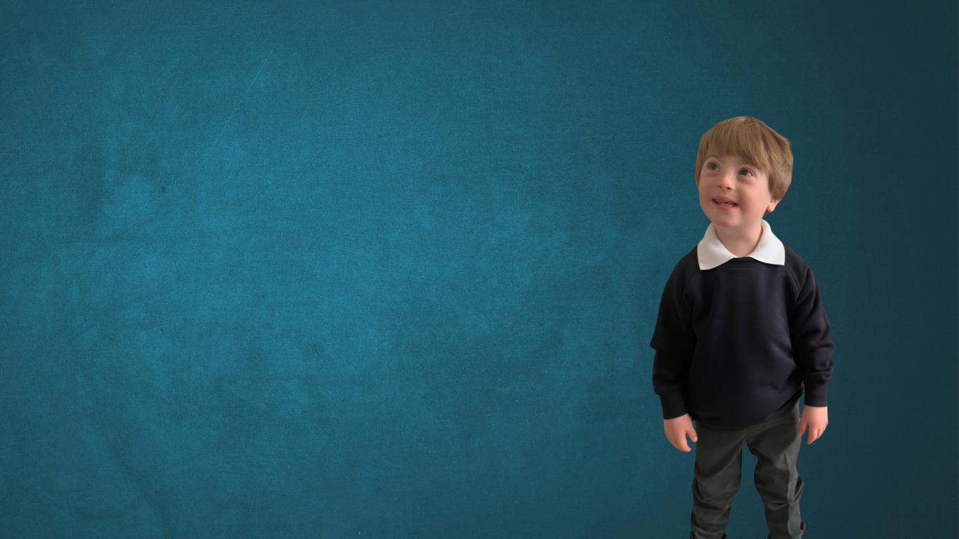 Child with down syndrome is wearing a school uniform and looking upwards smiling