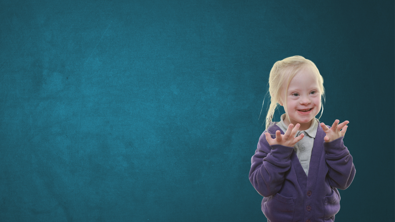 Child in primary holding hands out in a makaton sign